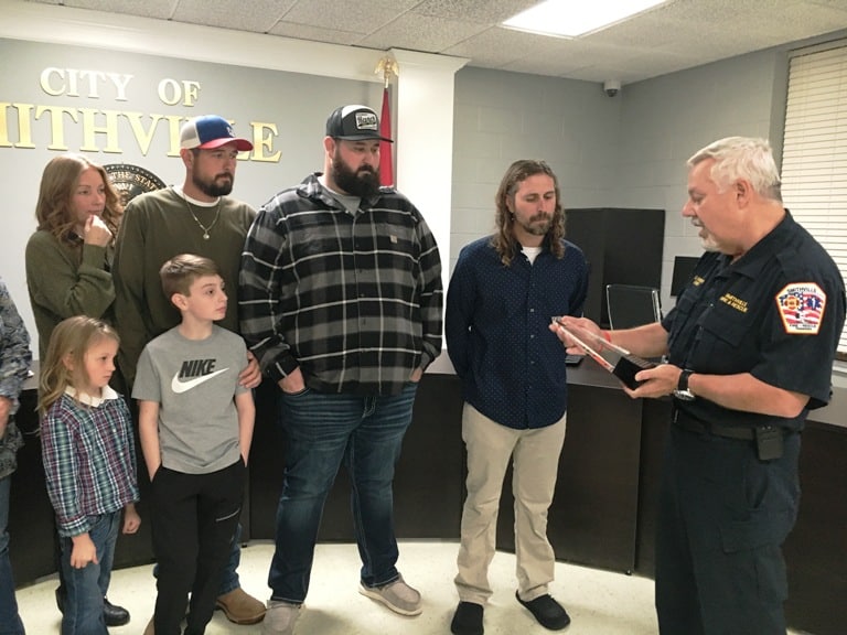 Fire Chief Charlie Parker presented the family of Hoyte Hale a special award on behalf of the department and a flag from Hale’s graveside service.