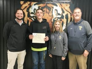 Shon Tucker, a twelfth grader at DCHS, prepared a winning essay in tribute to his parents for the honor of “Parents of the Month” for November. Daniel and Karie Tucker will receive a certificate from the school and a gift card for a meal at F.Z. Webb & Sons Soda Foundation. They were unable to attend the presentation of the award last week. (Pictured: DCHS Assistant Principal Seth Willoughby, Shon Tucker, DCHS Assistant Principal Jenny Norris, and DCHS Principal Bruce Curtis