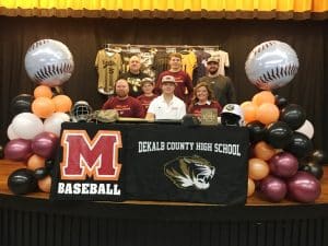 DCHS baseball senior Ty Webb signed with Maryville College Friday at DCHS. Pictured here left to right seated: DCHS Baseball Coach and Ty’s father Tad Webb, brother Tate, Ty Webb, and mother Tracy Webb. Standing left to right: Assistant Coach David Parker, brother Tucker Webb, and Assistant Coach Daniel Leslie