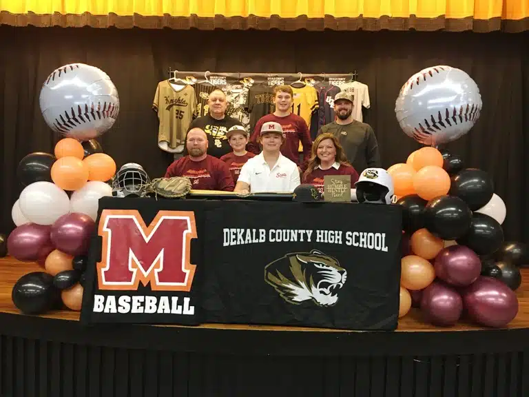 DCHS baseball senior Ty Webb signed with Maryville College Friday at DCHS. Pictured here left to right seated: DCHS Baseball Coach and Ty’s father Tad Webb, brother Tate, Ty Webb, and mother Tracy Webb. Standing left to right: Assistant Coach David Parker, brother Tucker Webb, and Assistant Coach Daniel Leslie