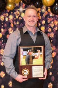 DCHS Football Coach Steve Trapp was presented a plaque by the Quarterback Club Saturday night during the annual awards banquet commemorating his 20th year as the Tiger Head Coach.