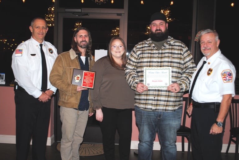 The late Smithville Volunteer Firefighter and Deputy Chief Hoyte Hale was posthumously honored Thursday night with the “Robert Eller Highest Attendance Award” as a volunteer for 2024. Members of Hale’s family accepted the award. Pictured left to right: Deputy Chief Jeff Wright, Devin Hale (son) Myrie Atnip (daughter in law), Quentin Hale (son), and Chief Charlie Parker