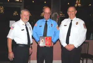 Smithville Firefighter William “Wink” Brown was presented a 50-year lifetime service award Thursday night. Brown, who has been a volunteer with the Smithville Fire Department for 27 years has dedicated his life and service to fire departments here and other places for 50 years. Pictured left to right: Fire Chief Charlie Parker, Wink Brown, and Deputy Chief Jeff Wright