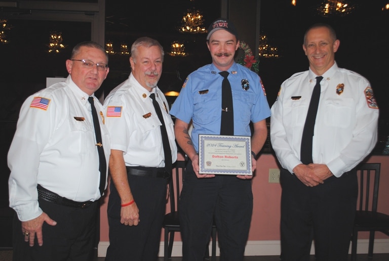 The top training award for a career city firefighter Thursday night went to Dalton Roberts, who put in 135 training hours. Pictured left to right: Captain Donnie Cantrell, Chief Charlie Parker, Dalton Roberts, and Deputy Chief Jeff Wright.