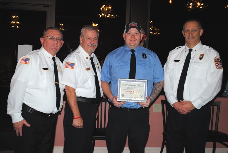 The top training award for a volunteer Thursday night went to Smithville Firefighter Joseph Taylor, who put in 135 training hours. Pictured left to right: Captain Donnie Cantrell, Chief Charlie Parker, Joseph Taylor, and Deputy Chief Jeff Wright.