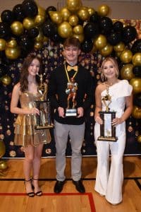 Senior Jordan Parker was named Most Valuable Player of the 2024 DCHS Tiger Football Team during the annual Awards Banquet held Saturday night at the Smithville First Baptist Church Life Enrichment Center building. Meanwhile, Caroline Crook (right) and Madeline Martin (left), both Seniors were co-winners of the Most Valuable Football Cheerleader Award. The trophies are sponsored by Liberty State Bank.