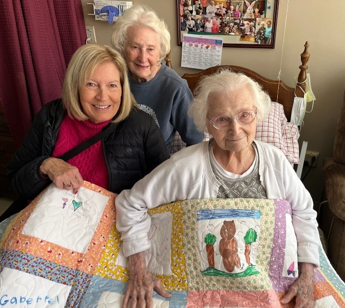 PatchWork UC blessed 4 DeKalb County residents with quilts this year. 3 were made from blocks that children created at the 2024 Regifting Event. The 4th was a handmade donated lap quilt. Mrs. Dean Edge, 99-year-old resident at NHC was given her quilt on Valentine’s Day. To date PatchWork UC has given out 38+ quilts. We want to thank all the talented quilters, children/volunteers that decorated the quilt squares all the businesses, organizations, churches and volunteers that made this possible. Most of all we want to thank God for the opportunity to serve our community.